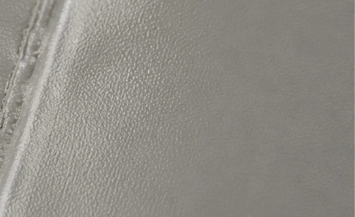Macro view of woven Oxford cloth texture beside a heat-welded PVC tarpaulin seam